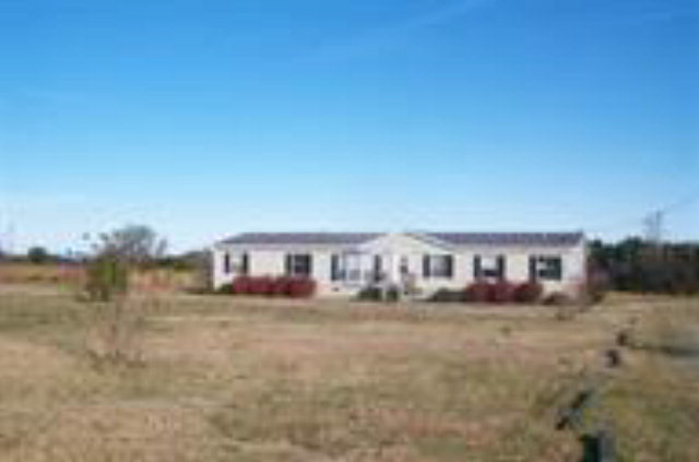 1096 River Road Fort Valley, GA 31030 - Photo 1 of 3 a view of a house with yard and sitting area