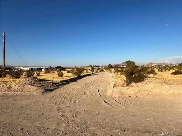 a view of a road with a building in the background