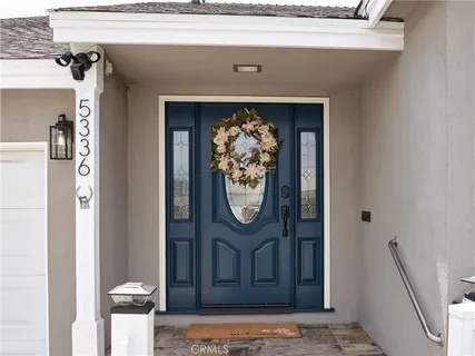a front view of a house with a mirror gate