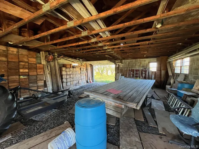 a view of a backyard with table and chairs