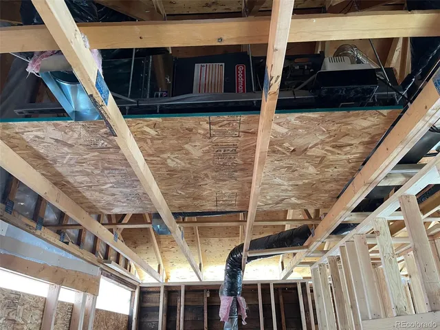 a view of a balcony with wooden floor and door