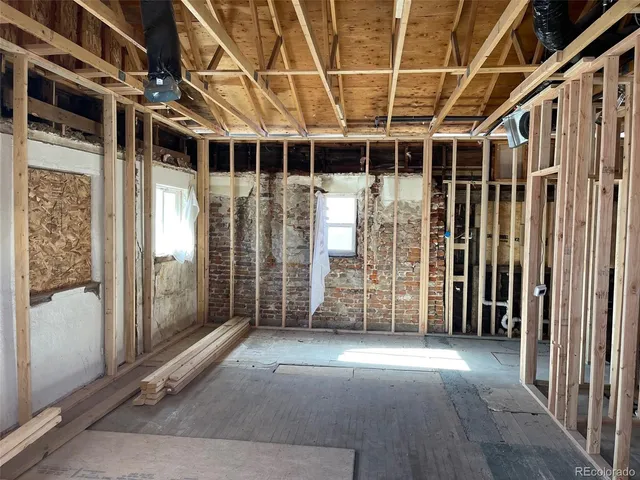 a view of a big room with wooden walls
