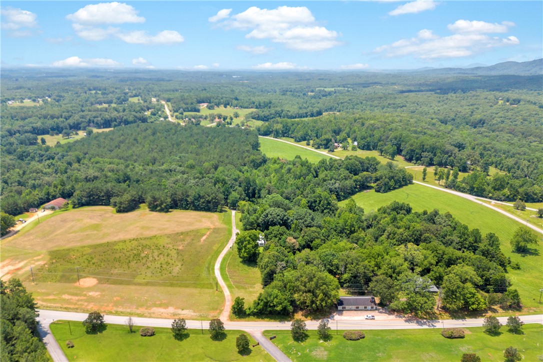 150 Newberry Road Walhalla, SC 29691 - Photo 43 of 47 Vast, verdant landscape offering a peaceful rural panorama under an expansive sky.