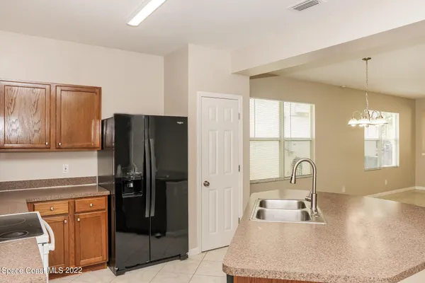a kitchen with a sink a stove and refrigerator