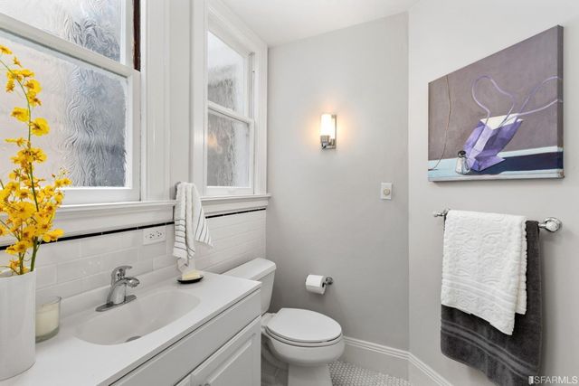 a picture of wall with a clock on a wall