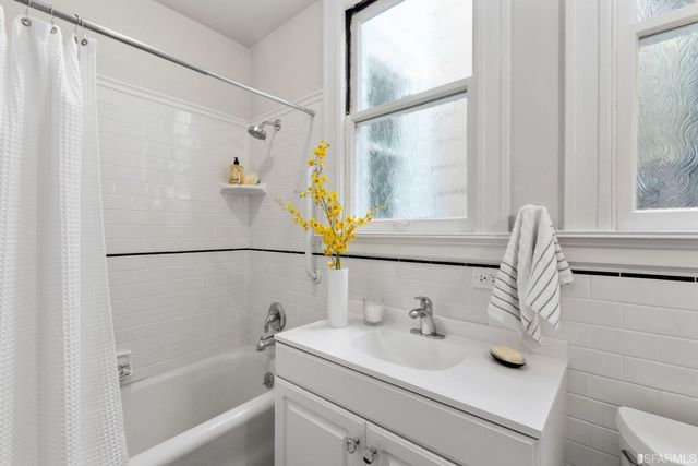 a view of yard with small fountain plants and large trees