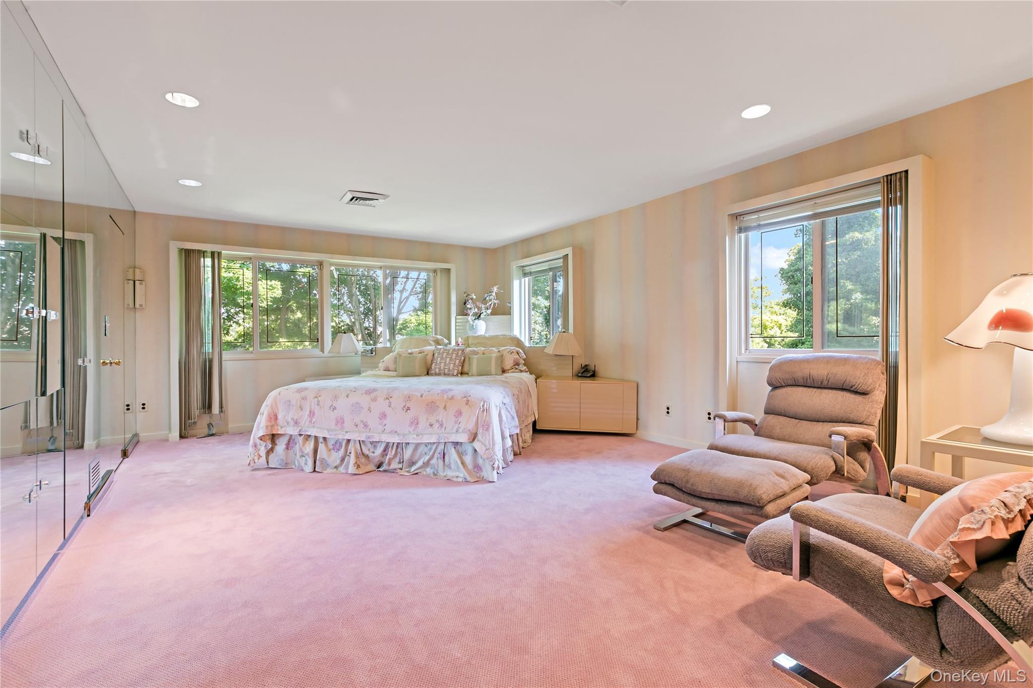 16 Meadow Road Scarsdale, NY 10583 - Photo 19 of 47 a bedroom with furniture and a large window