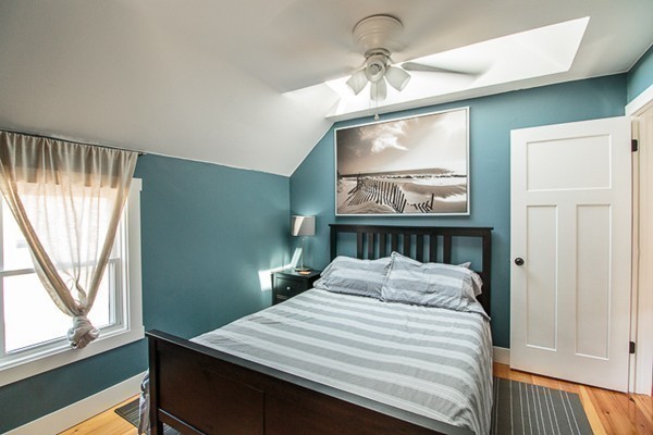 23 Massasoit Road Weymouth, MA 02191 - Photo 11 of 21 a bedroom with a bed and a window