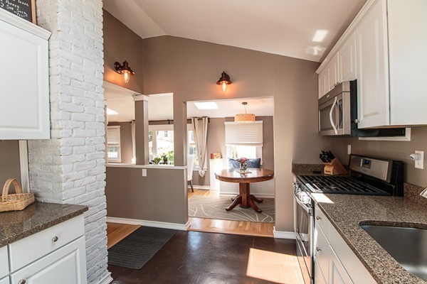 23 Massasoit Road Weymouth, MA 02191 - Photo 8 of 21 a kitchen with a sink a stove and cabinets