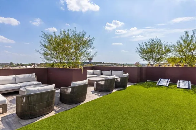 a view of a backyard with sitting area