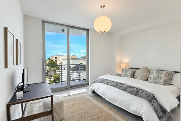 a large spacious bathroom with a large tub and chandelier