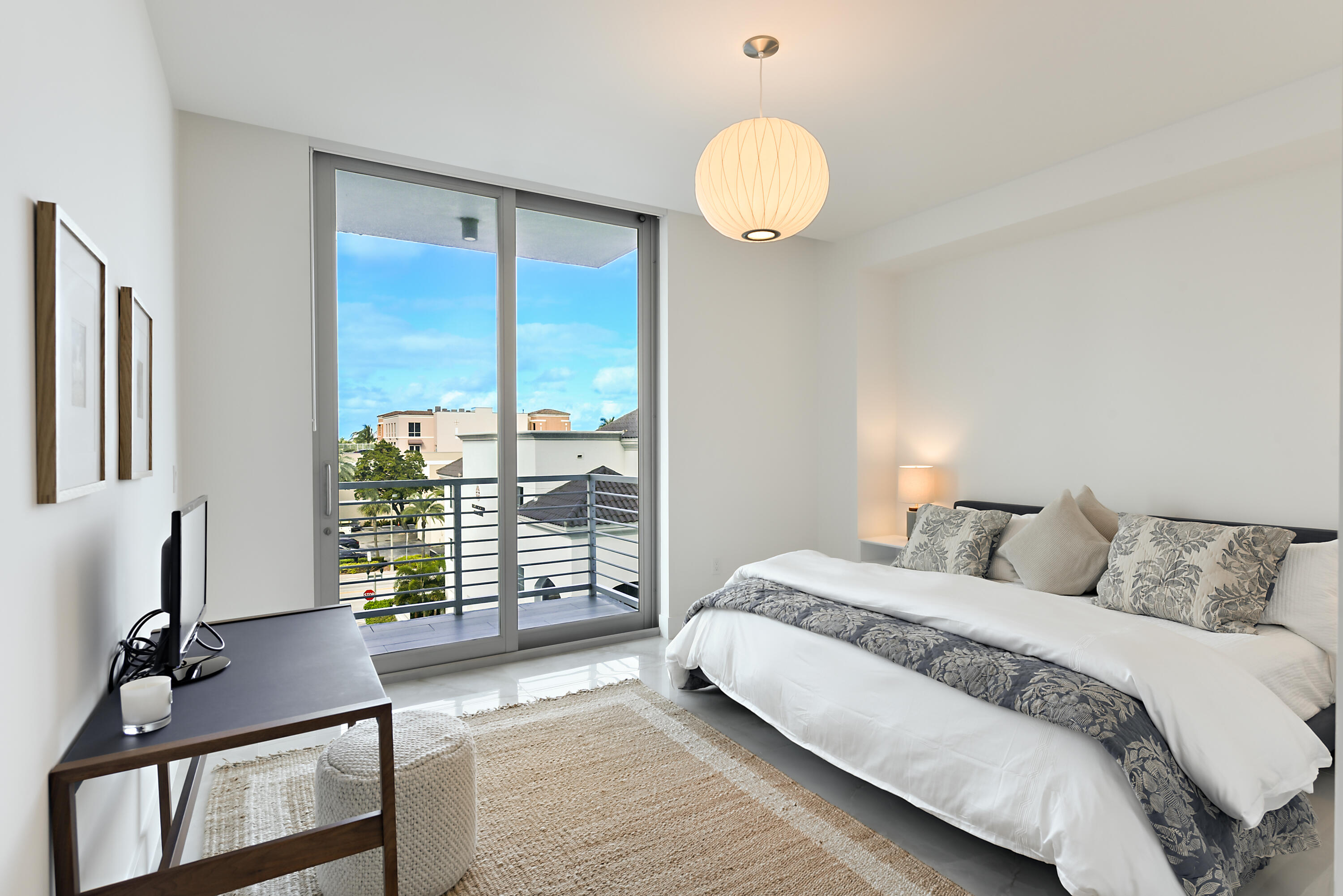 485 East Royal Palm Road, Unit 403 Boca Raton, FL 33432 - Photo 21 of 74 a bedroom with a bed and glass door