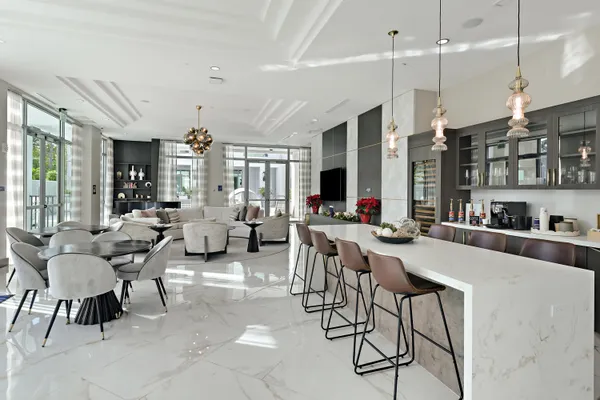 a view of a park with potted plants and palm trees