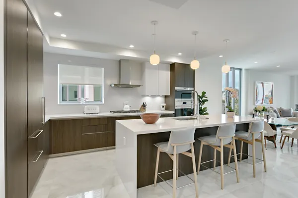 a view of a dining room with furniture and a potted plant
