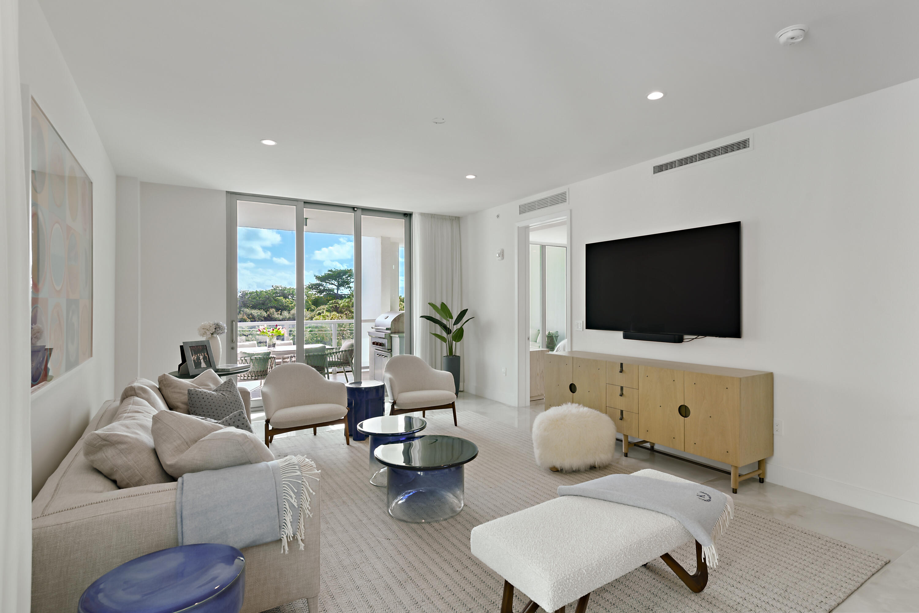 485 East Royal Palm Road, Unit 403 Boca Raton, FL 33432 - Photo 10 of 74 a living room with furniture and a flat screen tv