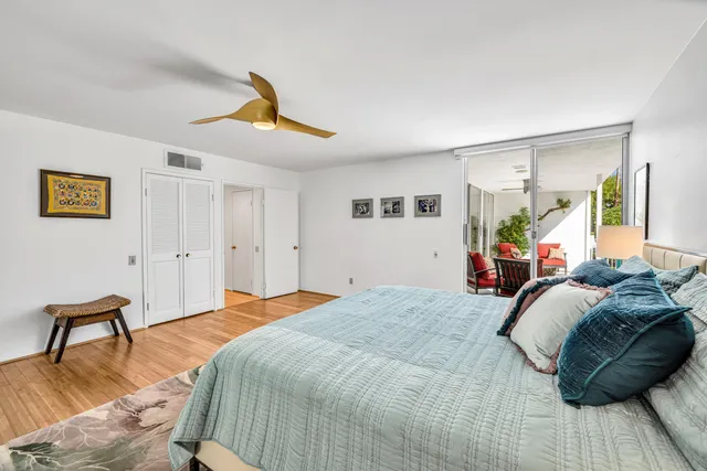 a bathroom with double vanity and a mirror