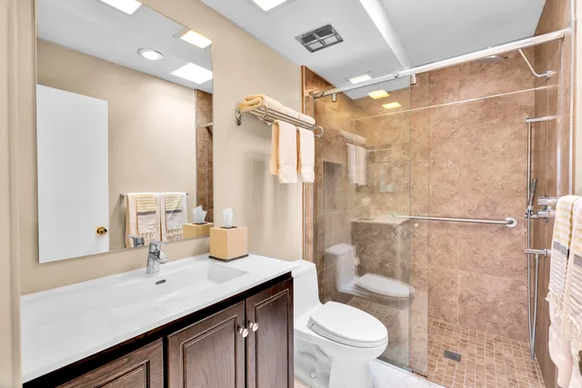 a view of living room filled with furniture and floor to ceiling window