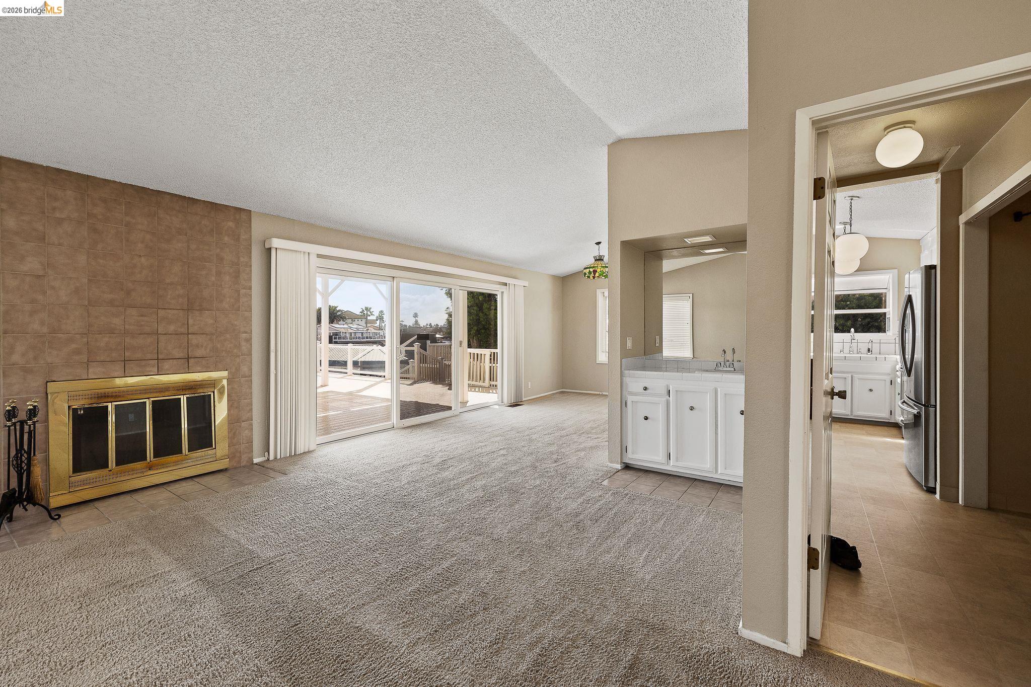 1147 Willow Lake Road Discovery Bay, CA 94505 - Photo 13 of 59 a large white kitchen with stainless steel appliances a large window