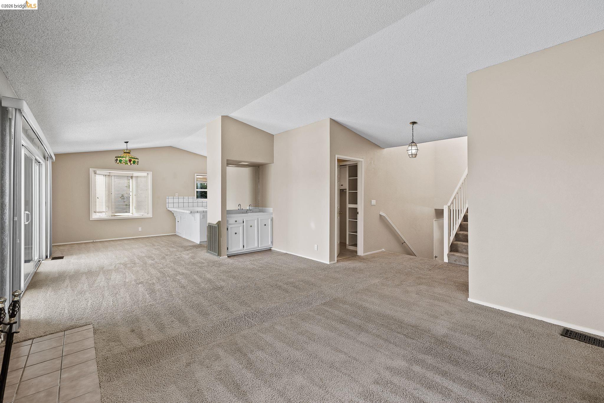 1147 Willow Lake Road Discovery Bay, CA 94505 - Photo 15 of 59 a view of empty room with a garage and stairs