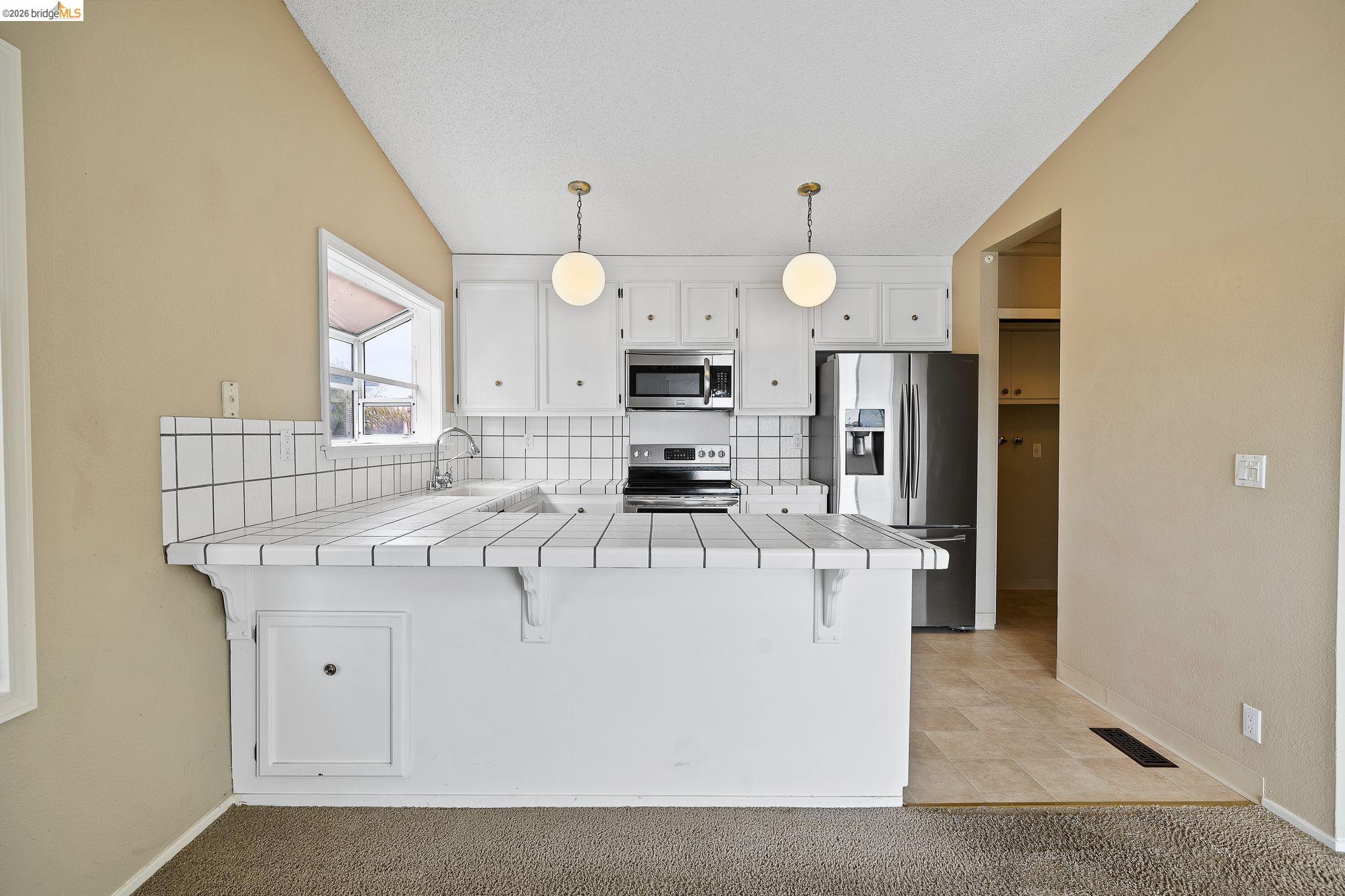 1147 Willow Lake Road Discovery Bay, CA 94505 - Photo 19 of 59 a view of kitchen with stainless steel appliances granite countertop a sink a stove and a refrigerator