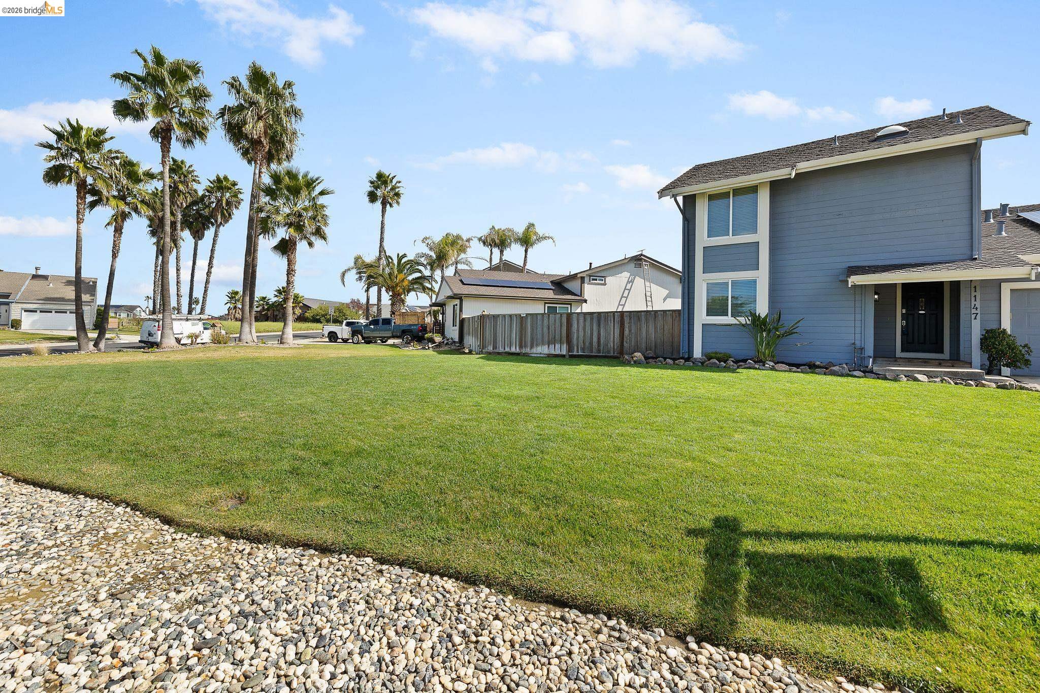 1147 Willow Lake Road Discovery Bay, CA 94505 - Photo 2 of 59 a view of a house with a big yard and potted plants