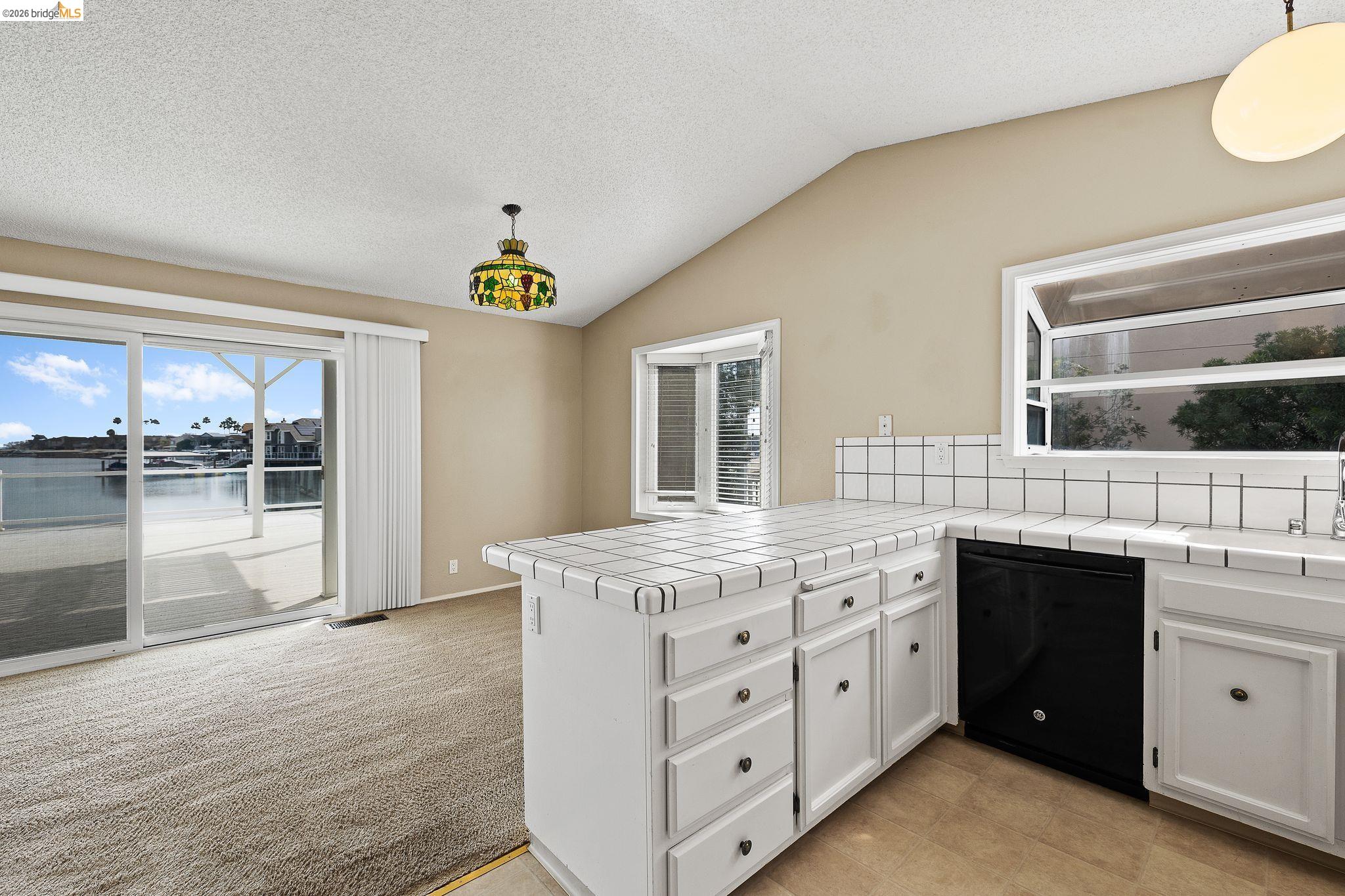 1147 Willow Lake Road Discovery Bay, CA 94505 - Photo 21 of 59 a kitchen with a stove a sink and a window