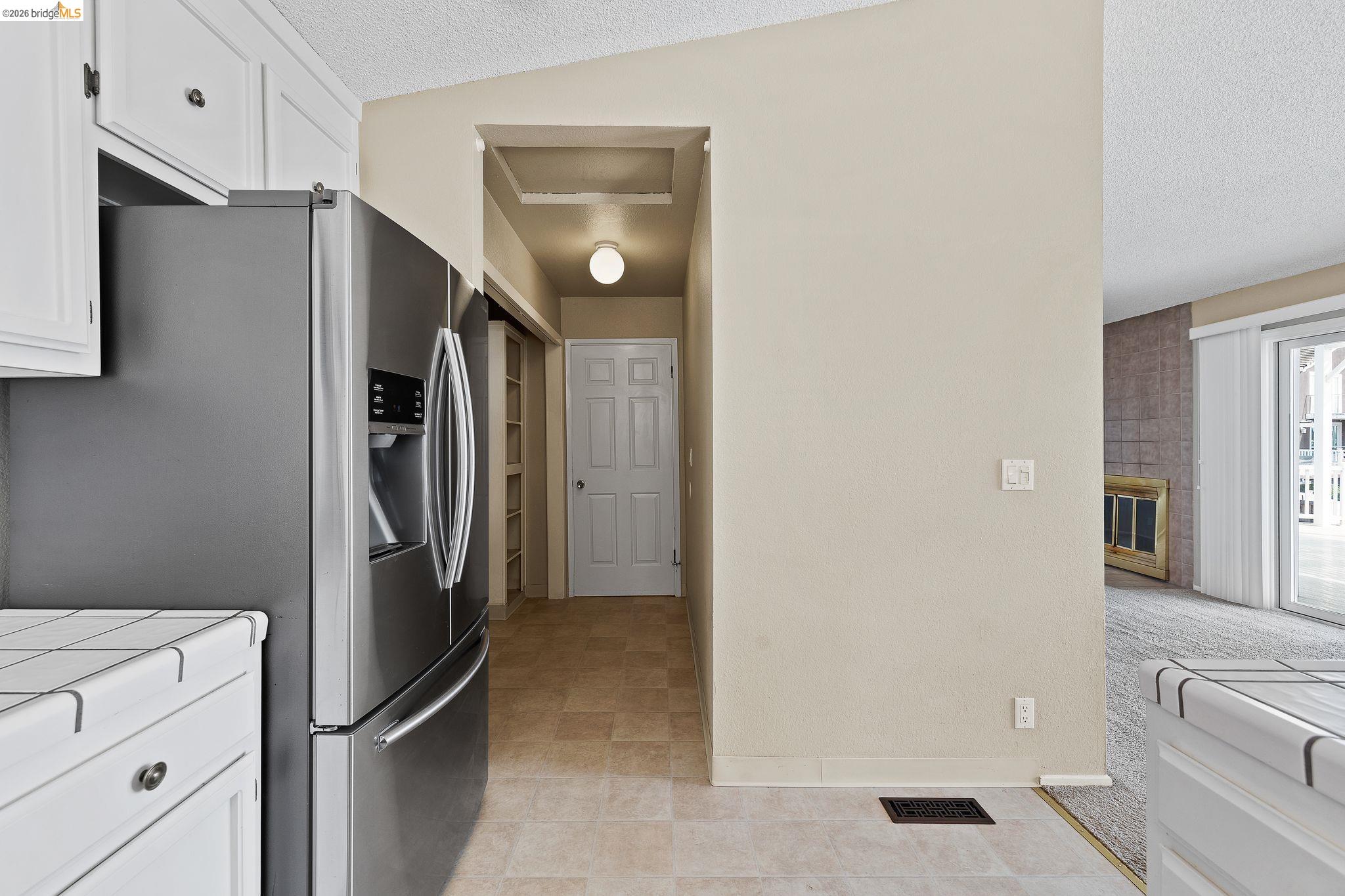 1147 Willow Lake Road Discovery Bay, CA 94505 - Photo 24 of 59 a kitchen with stainless steel appliances a refrigerator and cabinets