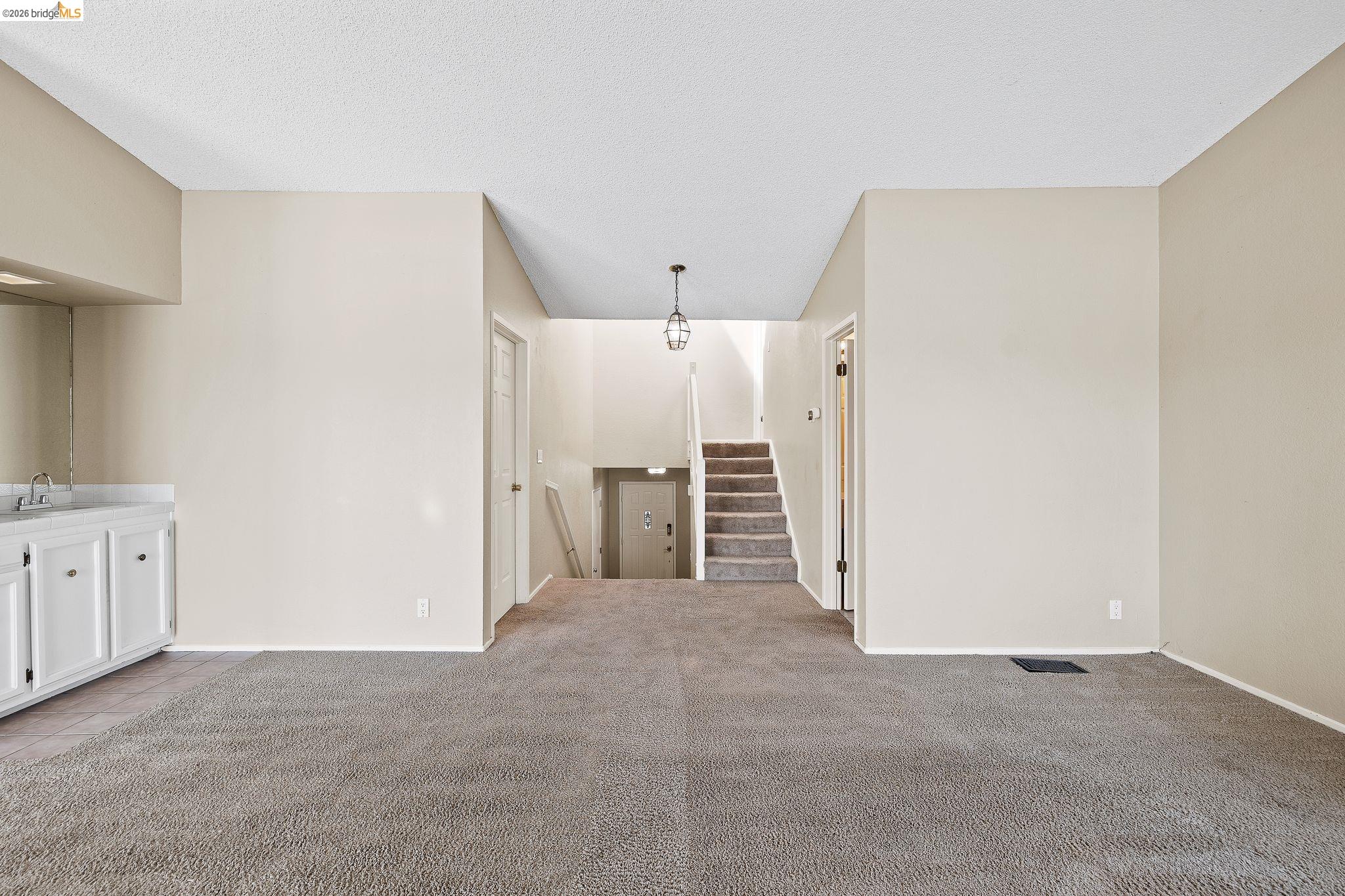 1147 Willow Lake Road Discovery Bay, CA 94505 - Photo 27 of 59 a view of a kitchen with white cabinets and wooden floors