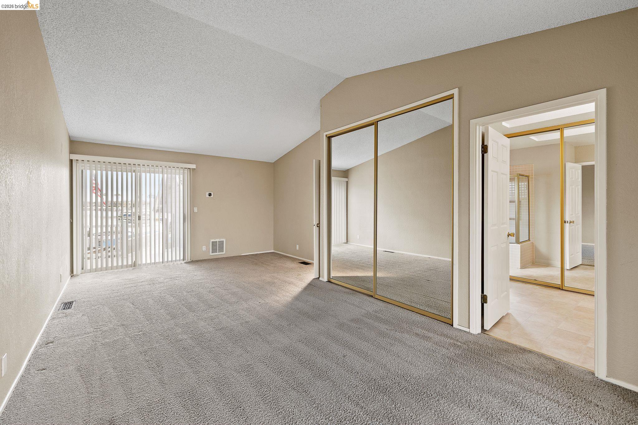 1147 Willow Lake Road Discovery Bay, CA 94505 - Photo 34 of 59 Unfurnished bedroom with light carpet and a closet