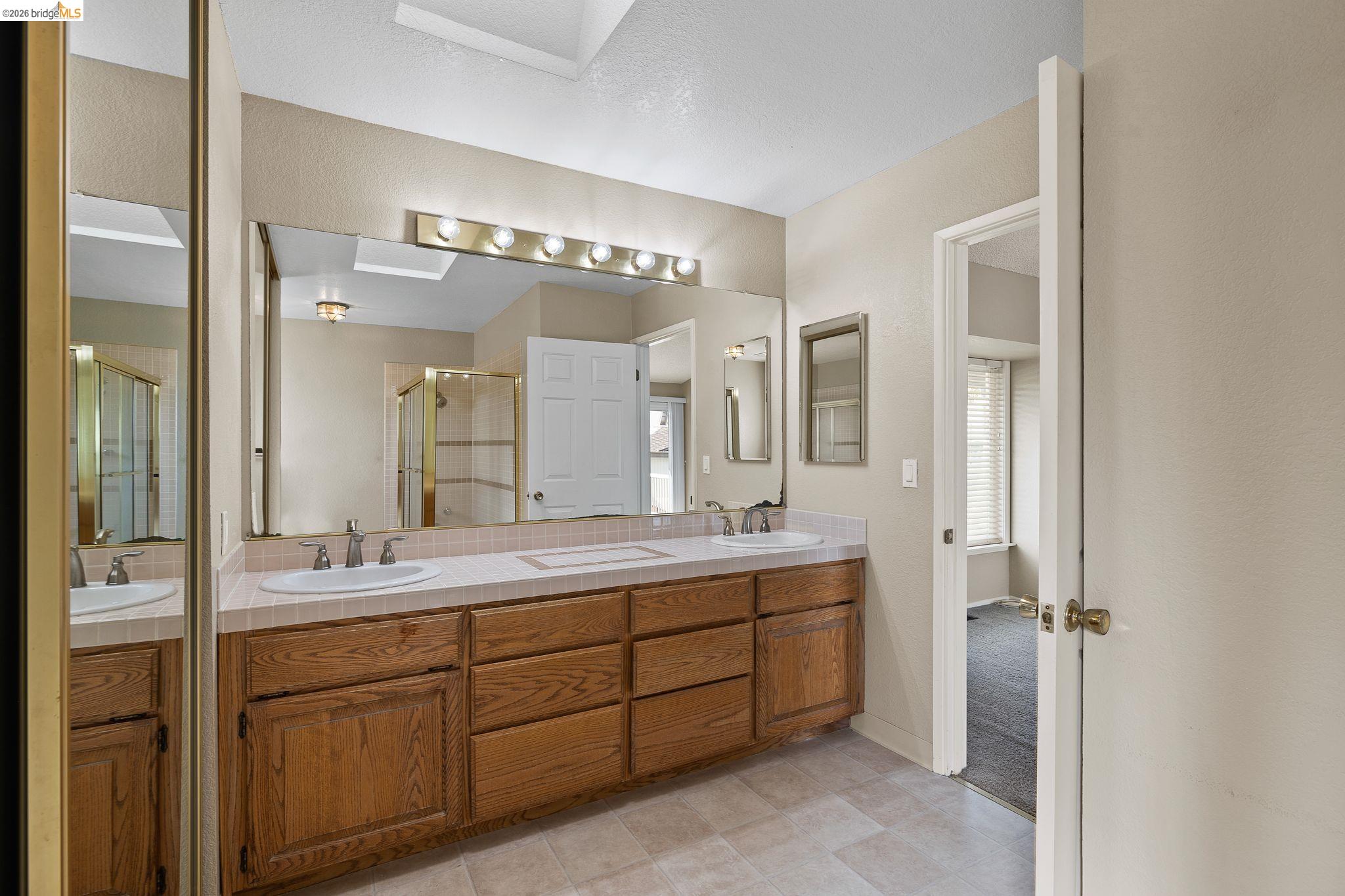 1147 Willow Lake Road Discovery Bay, CA 94505 - Photo 36 of 59 a spacious bathroom with a double vanity sink mirror and double