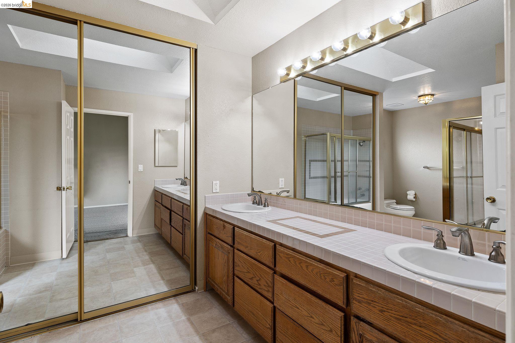 1147 Willow Lake Road Discovery Bay, CA 94505 - Photo 37 of 59 a spacious bathroom with a double vanity sink mirror and double