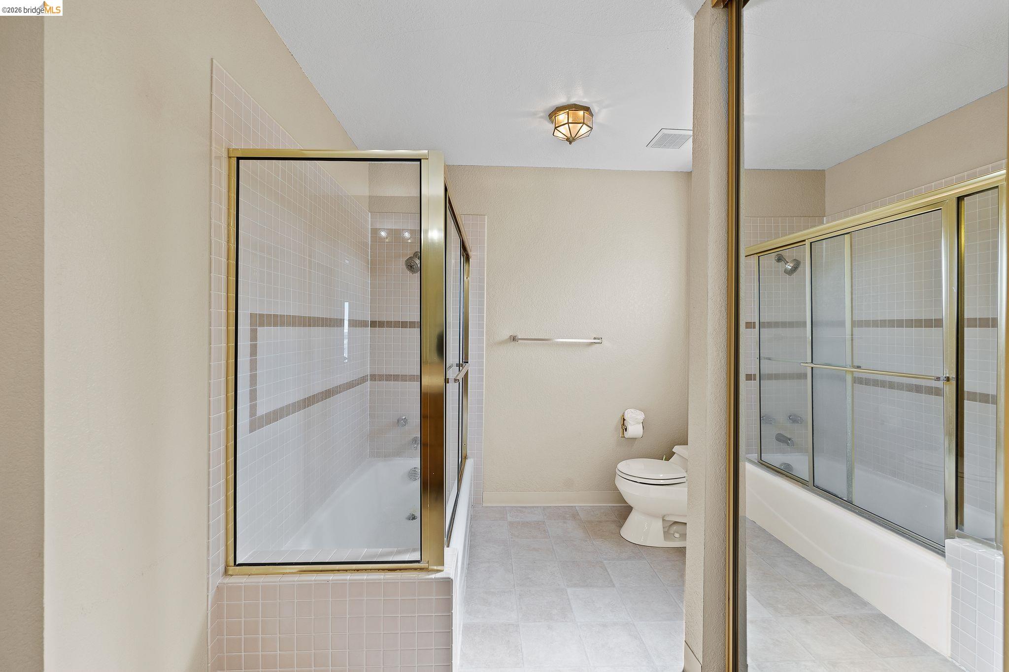1147 Willow Lake Road Discovery Bay, CA 94505 - Photo 38 of 59 a bathroom with a granite countertop shower and a toilet