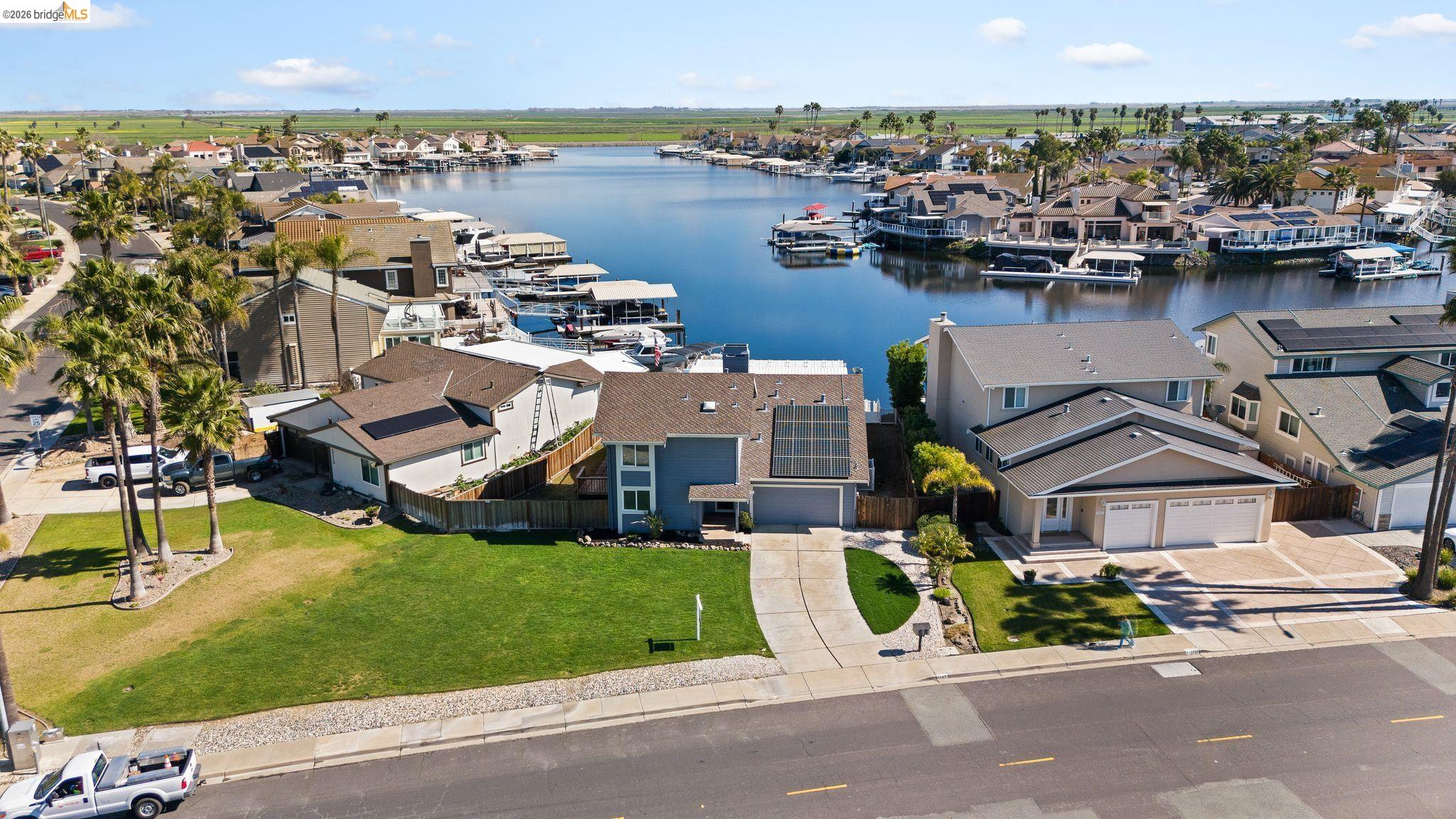 1147 Willow Lake Road Discovery Bay, CA 94505 - Photo 54 of 59 an aerial view of a house with a garden and lake view