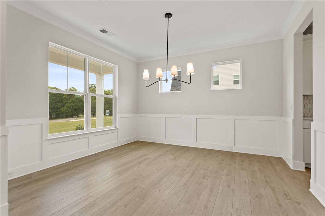 313 Old Shirley Road Central, SC 29630 - Photo 3 of 30 This spacious room features ample natural light and elegant wainscoting.