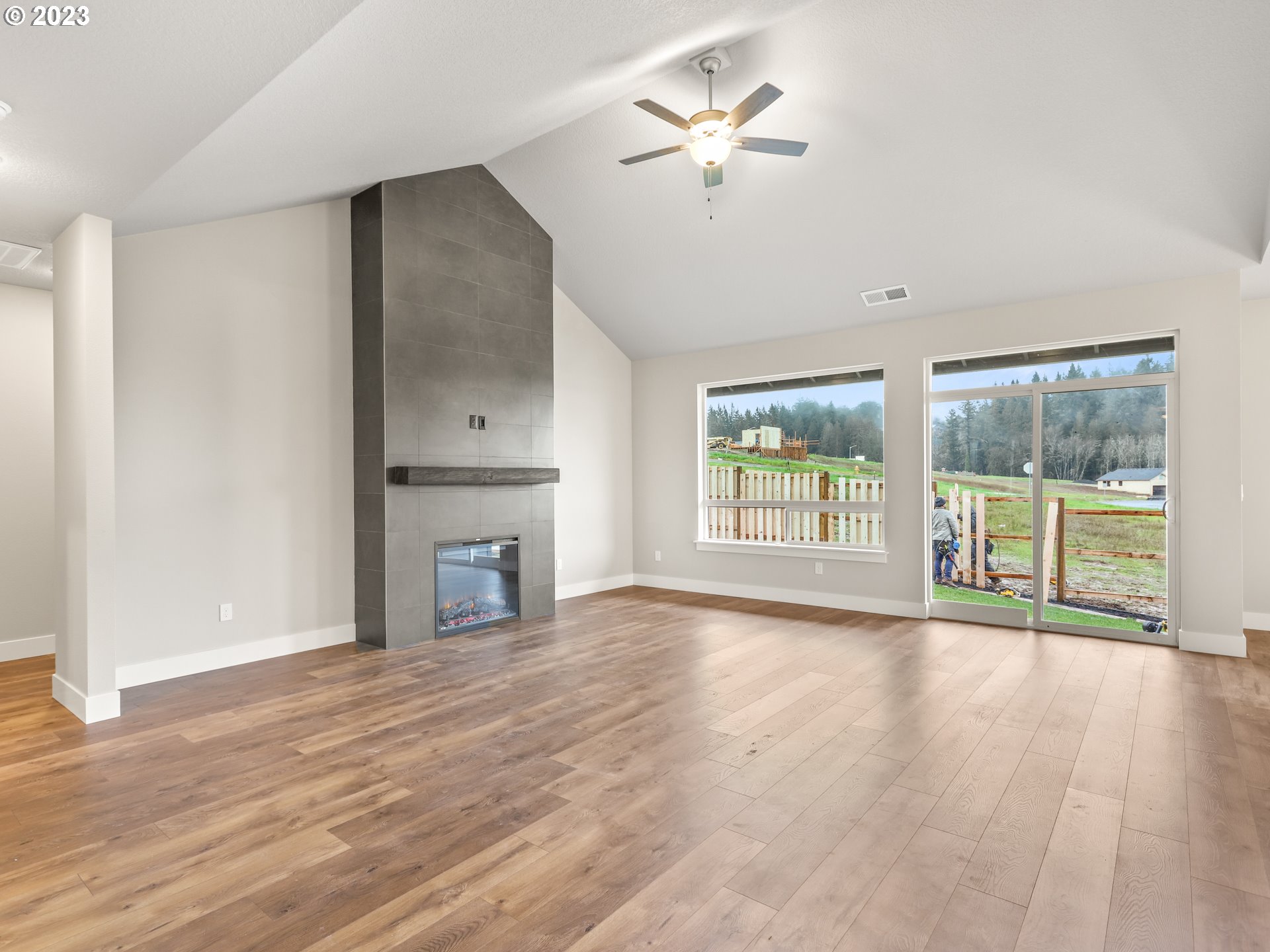 652 Northeast Pinebreak Drive Estacada, OR 97023 - Photo 18 of 40 a view of an empty room with a window and wooden floor