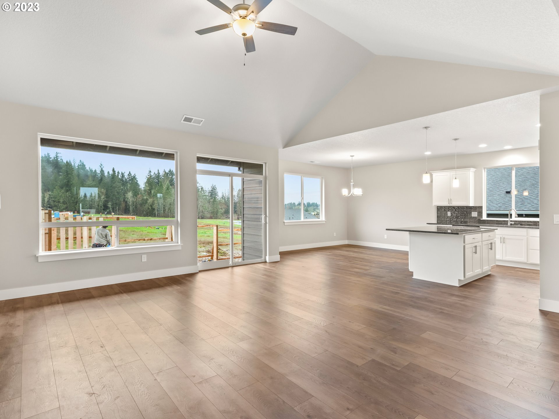 652 Northeast Pinebreak Drive Estacada, OR 97023 - Photo 19 of 40 a view of an empty room with a window and wooden floor