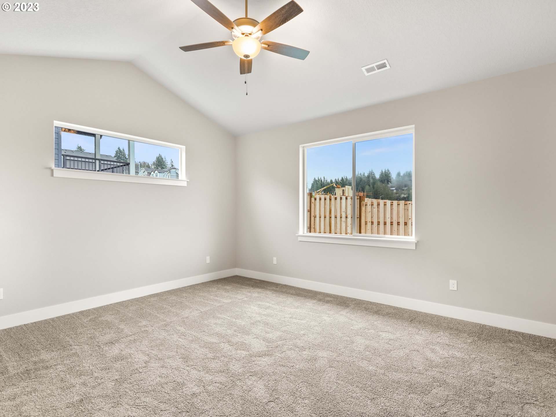 652 Northeast Pinebreak Drive Estacada, OR 97023 - Photo 27 of 40 an empty room with windows and fan