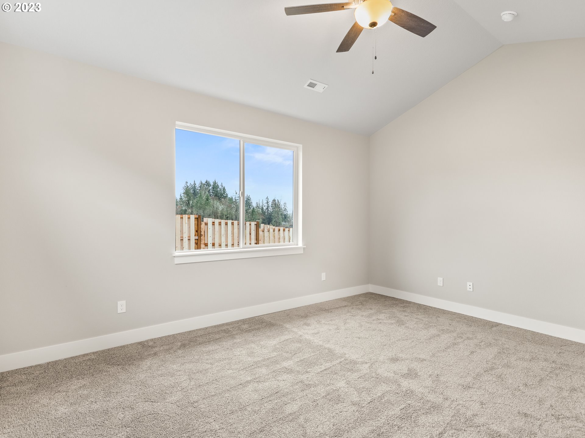 652 Northeast Pinebreak Drive Estacada, OR 97023 - Photo 30 of 40 an empty room with a window and a fan