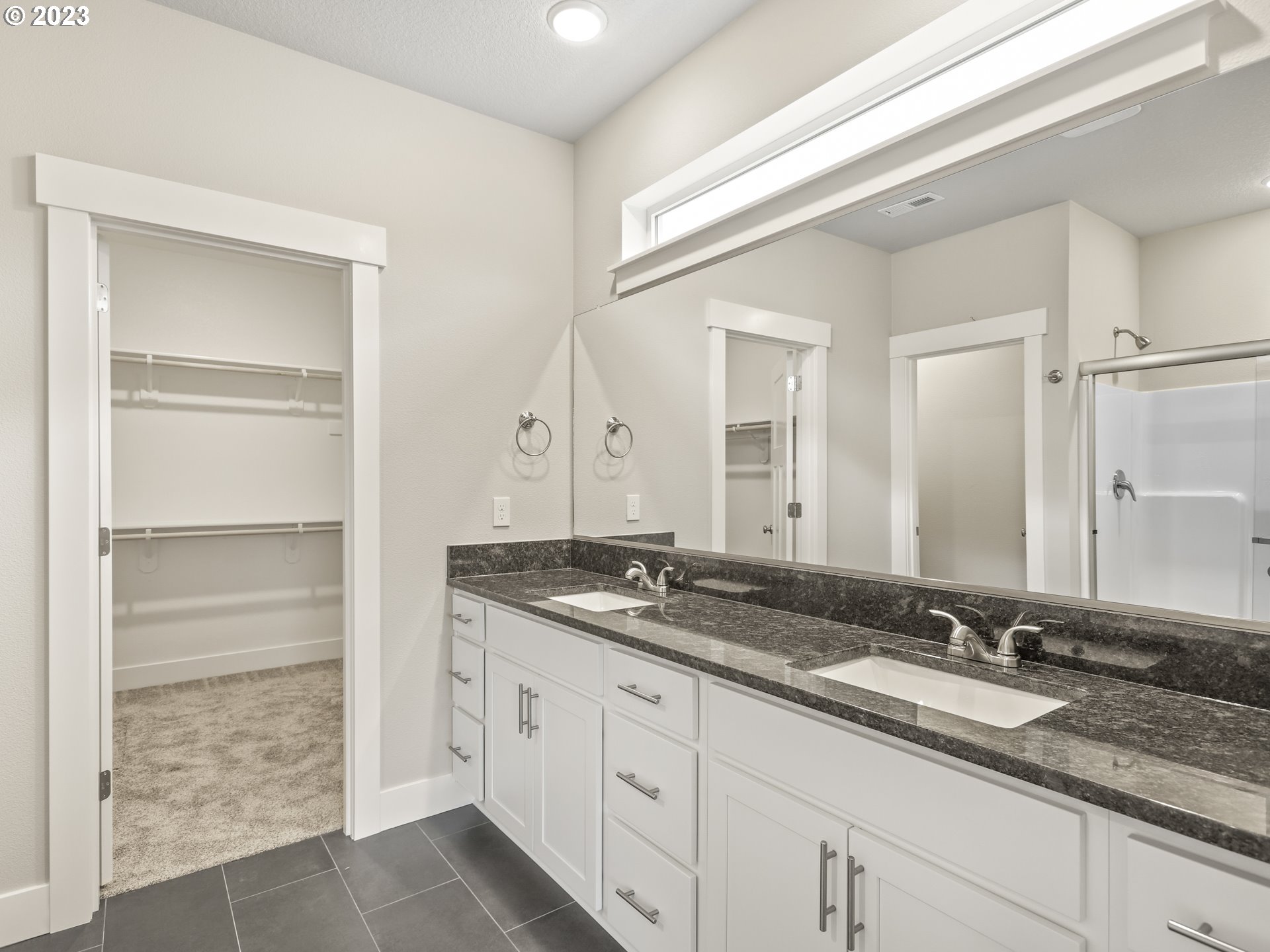 652 Northeast Pinebreak Drive Estacada, OR 97023 - Photo 31 of 40 a bathroom with a granite countertop sink and a mirror