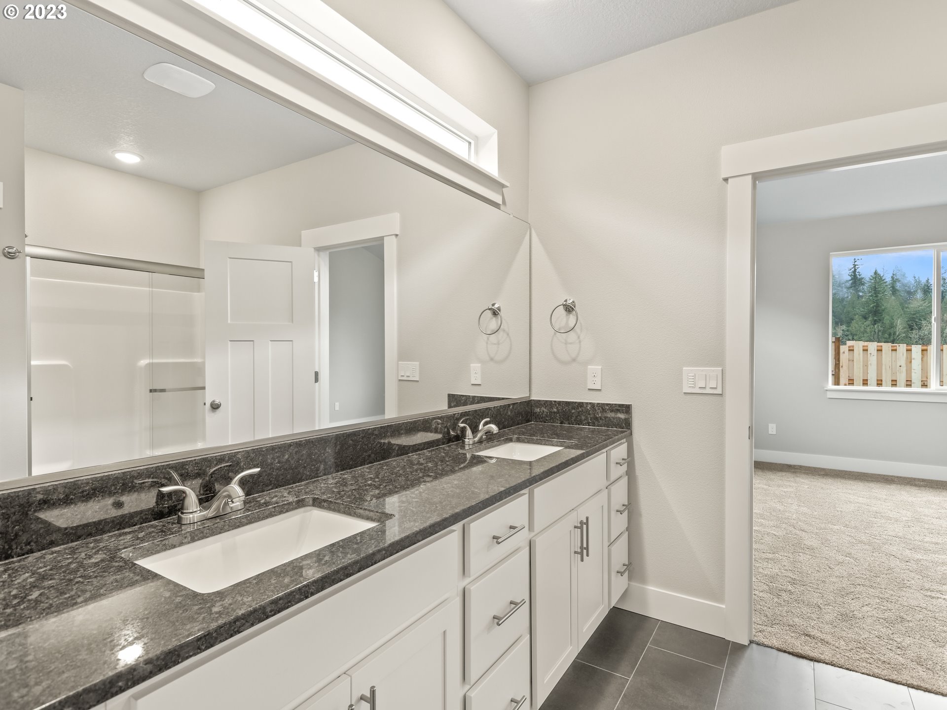 652 Northeast Pinebreak Drive Estacada, OR 97023 - Photo 32 of 40 a spacious bathroom with a granite countertop double vanity sink and a mirror