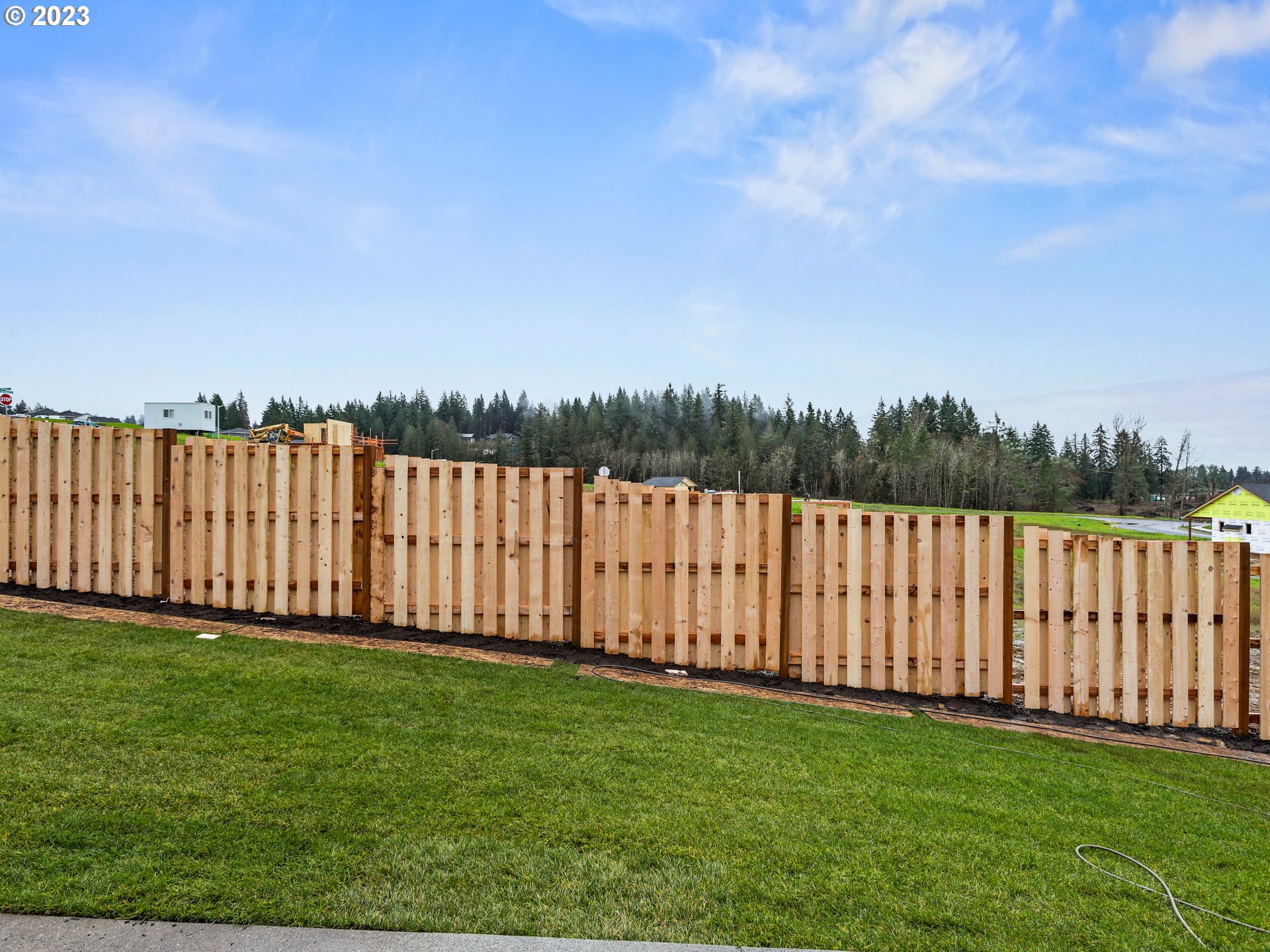 652 Northeast Pinebreak Drive Estacada, OR 97023 - Photo 38 of 40 a view of a yard with wooden fence