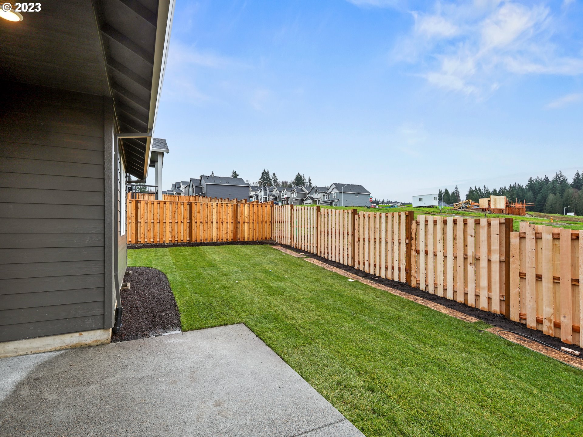 652 Northeast Pinebreak Drive Estacada, OR 97023 - Photo 39 of 40 a view of a garden with wooden fence