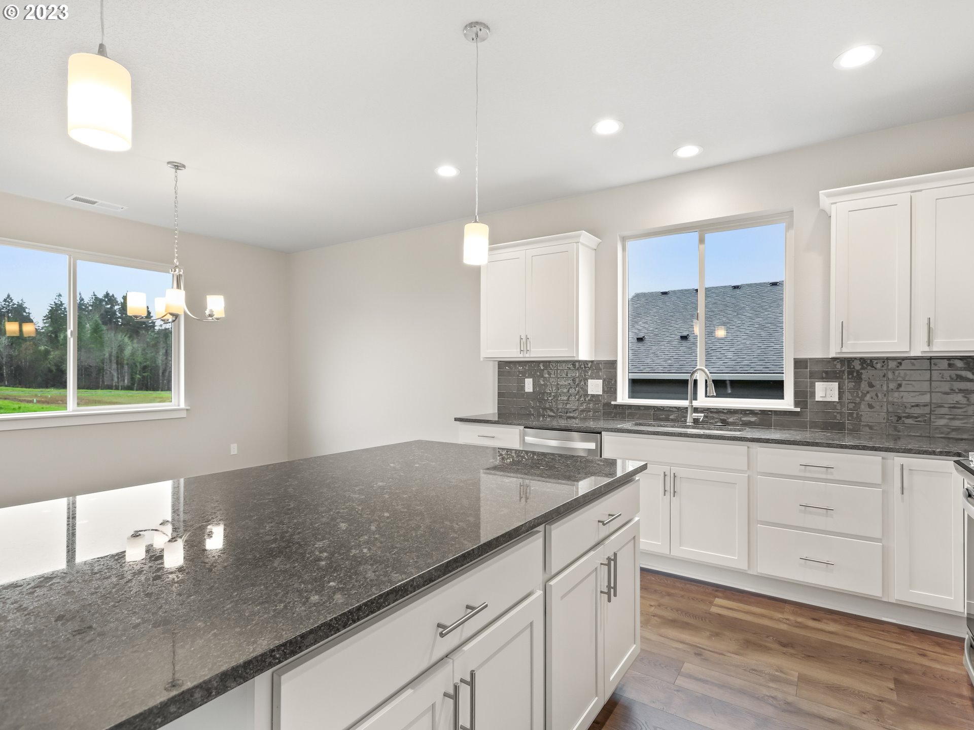 652 Northeast Pinebreak Drive Estacada, OR 97023 - Photo 9 of 40 a kitchen with a sink window and cabinets