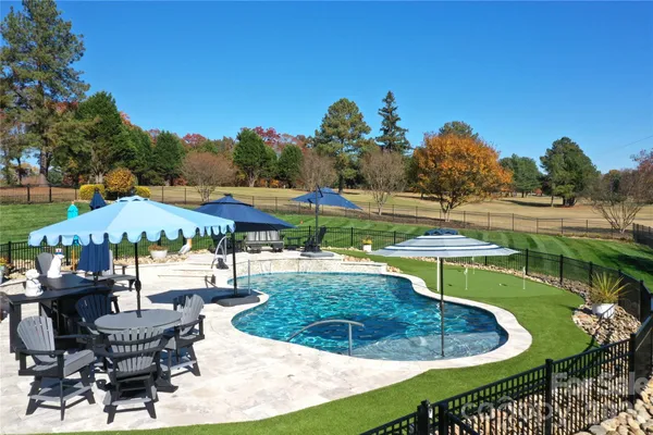 a view of a swimming pool with a patio