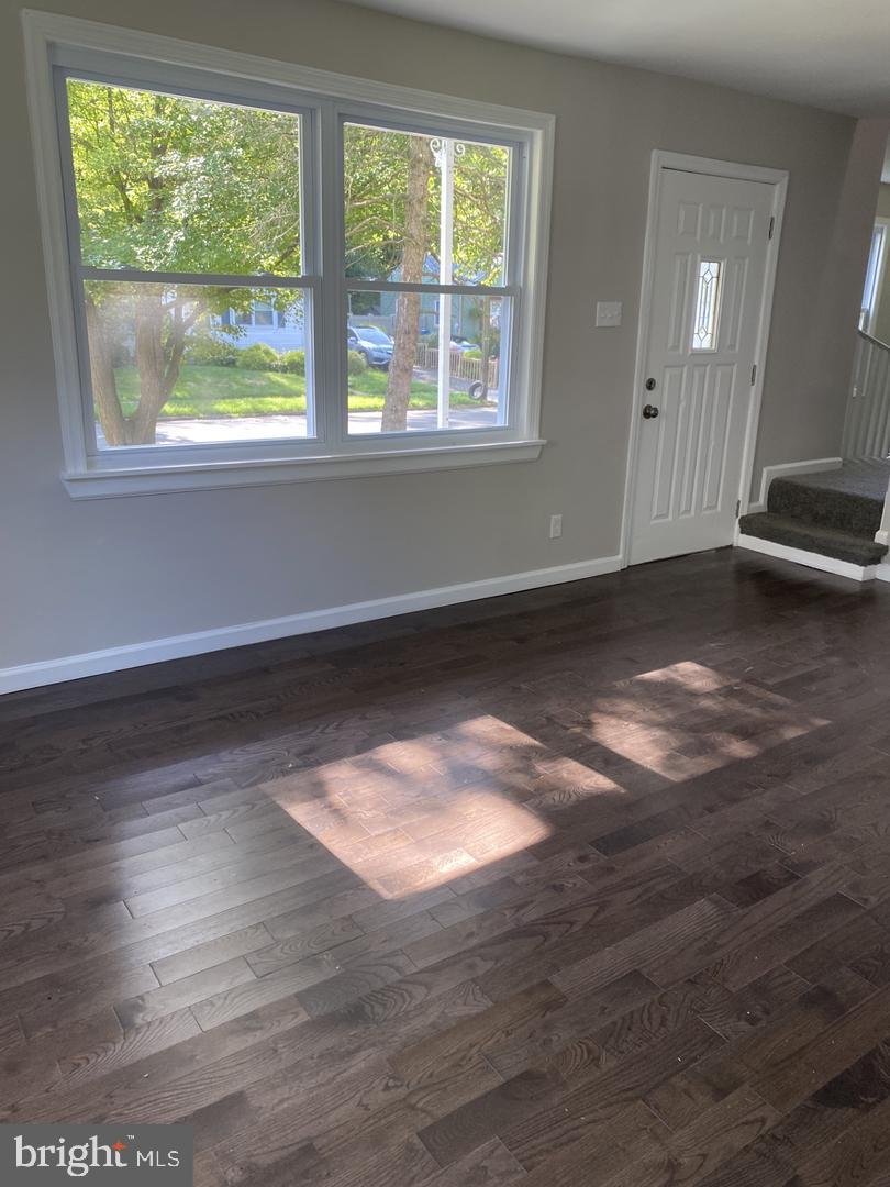 111 Edison Road Cherry Hill, NJ 08034 - Photo 6 of 8 an empty room with wooden floor and windows