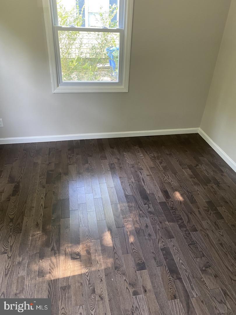 111 Edison Road Cherry Hill, NJ 08034 - Photo 8 of 8 an empty room with wooden floor and windows