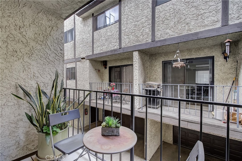655 Alexander Street, Unit 3 Glendale, CA 91203 - Photo 6 of 26 a view of a balcony with furniture and wooden floor