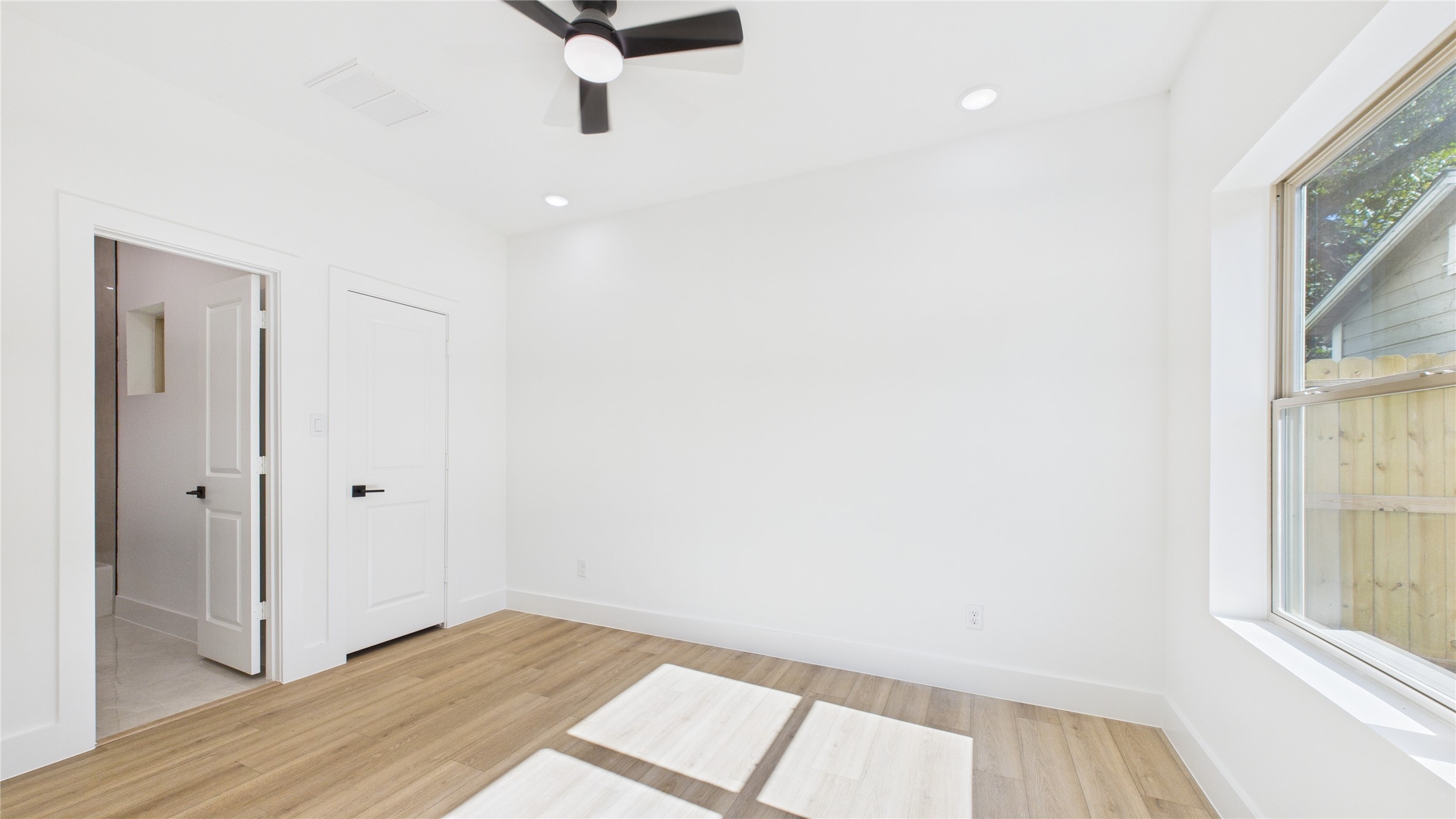 5318 Terry Street Houston, TX 77009 - Photo 6 of 28 a view of a room with wooden floor and windows