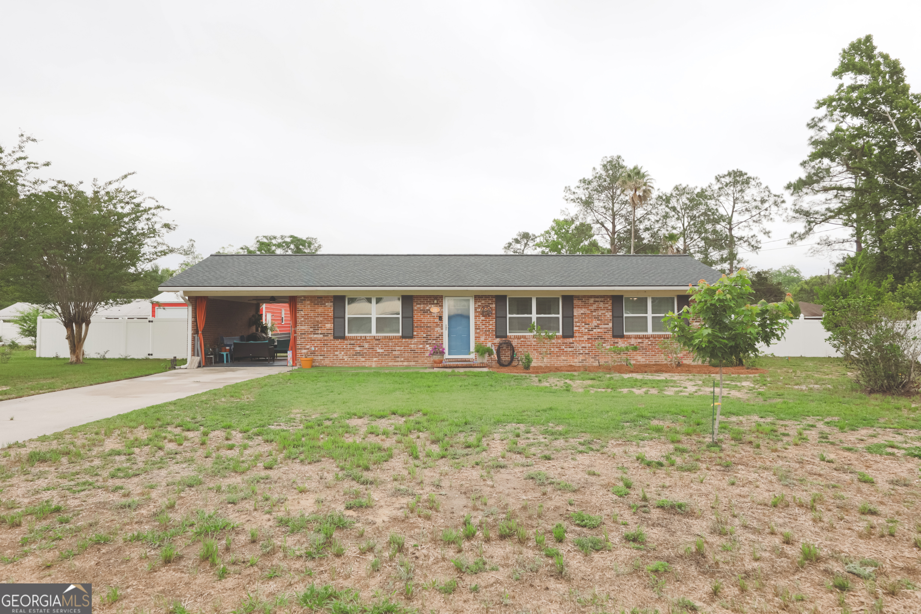 106 Beaver Drive Blackshear, GA 31516 - Photo 1 of 20 a front view of a house with garden