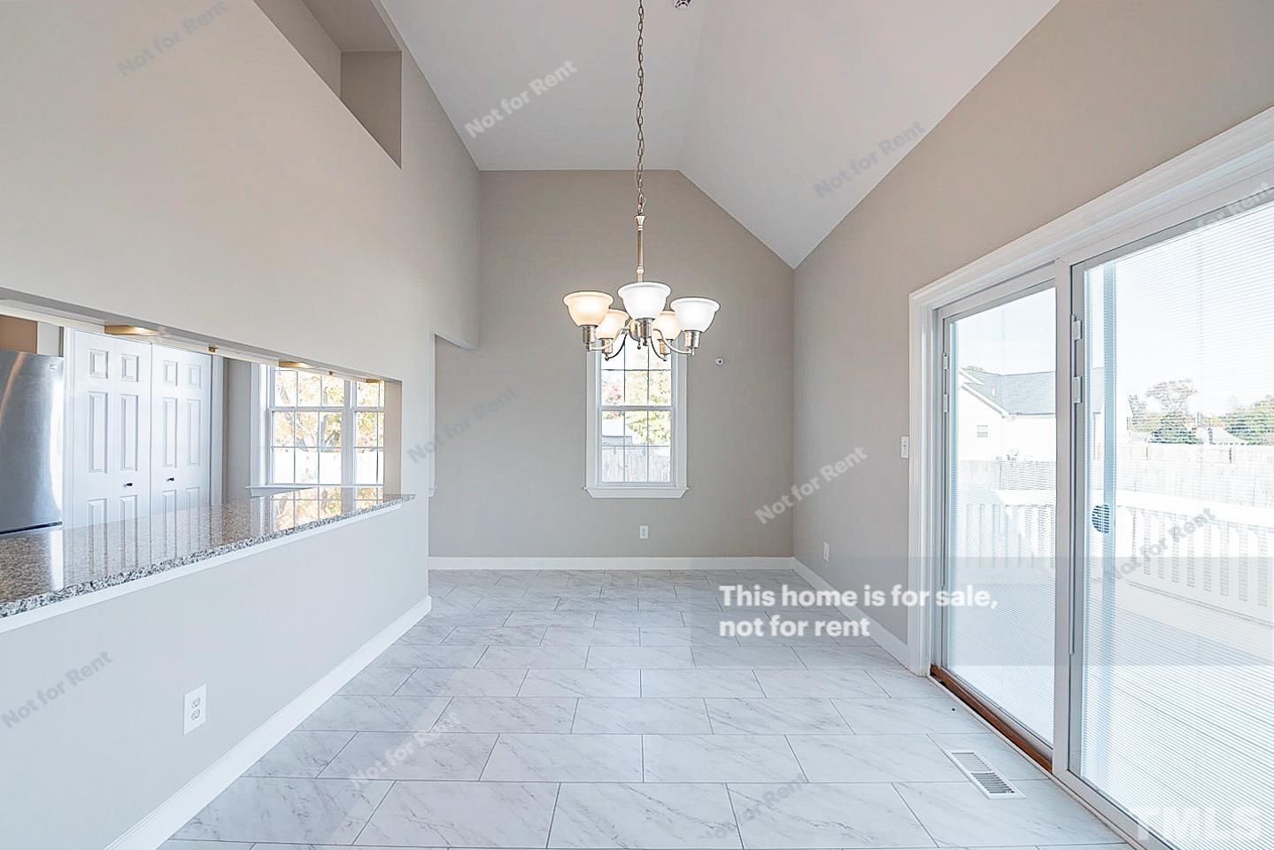 8909 Sauls Road Raleigh, NC 27603 - Photo 12 of 23 a view of an empty room with a window